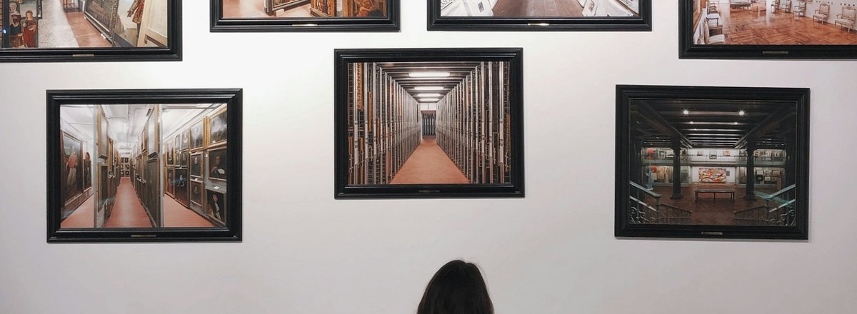 Woman viewing artwork in museum